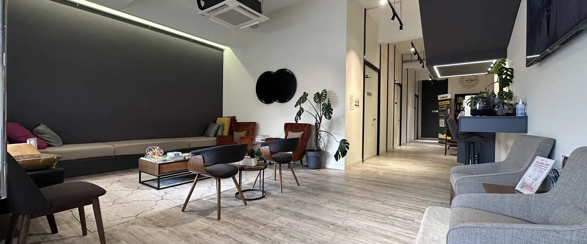 The full length of the Remedine Clinic lounge, from the waiting area to the corridor
