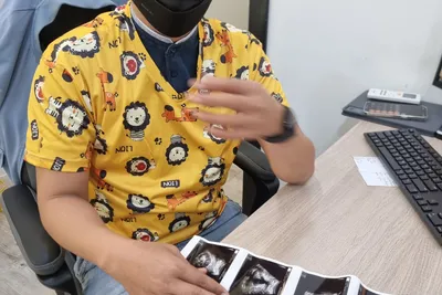 Dr Mohd Sufian reviewing an antenatal scan printout