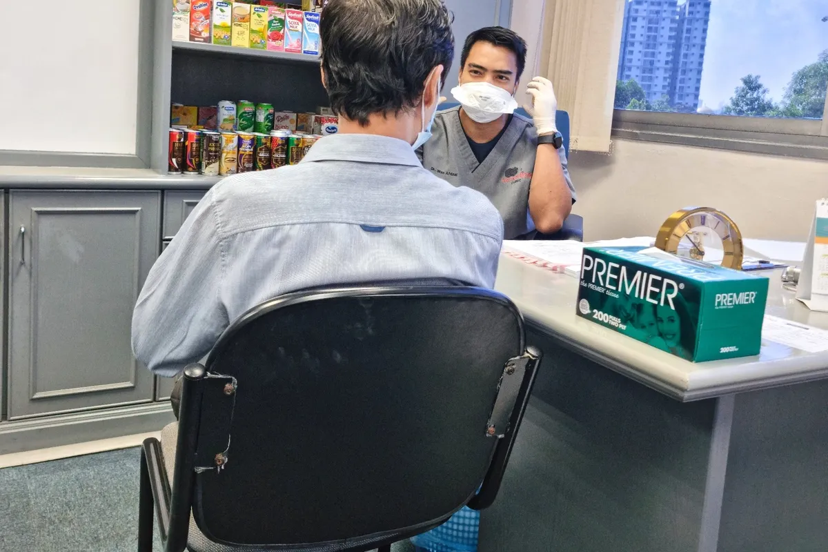 A Remedine doctor consulting an employee during a company onsite visit