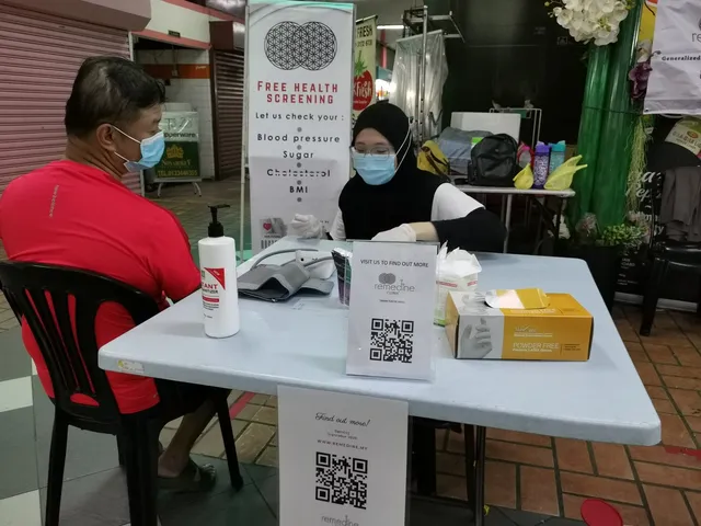 A free blood-pressure check at the Remedine outreach table before the clinic opened in 2020