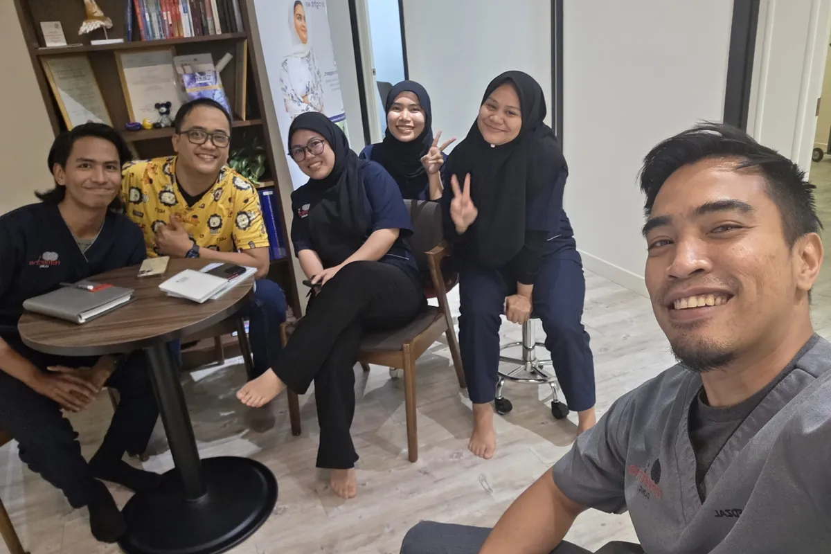 The Remedine Clinic team gathered together in the waiting lounge