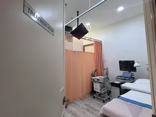 Looking into the treatment room at Remedine Clinic through its open door