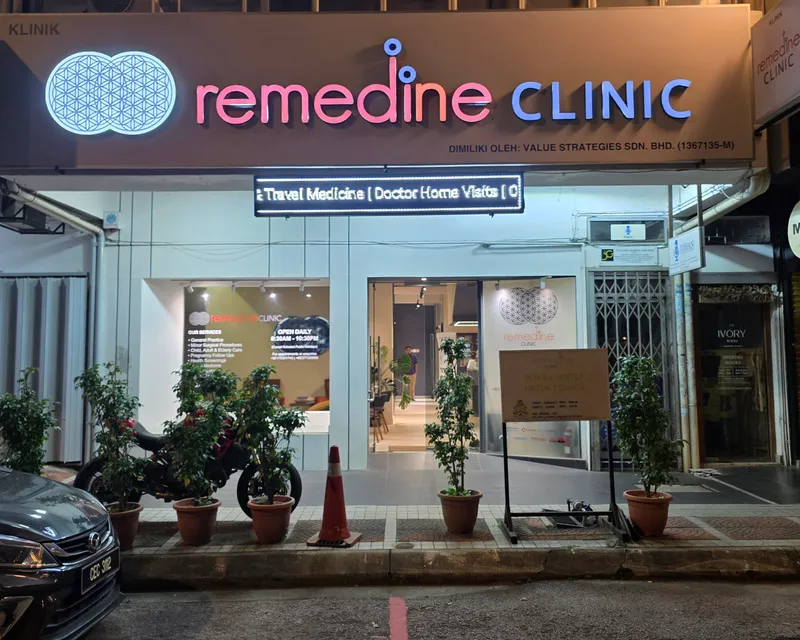 Remedine Clinic TTDI storefront lit at night