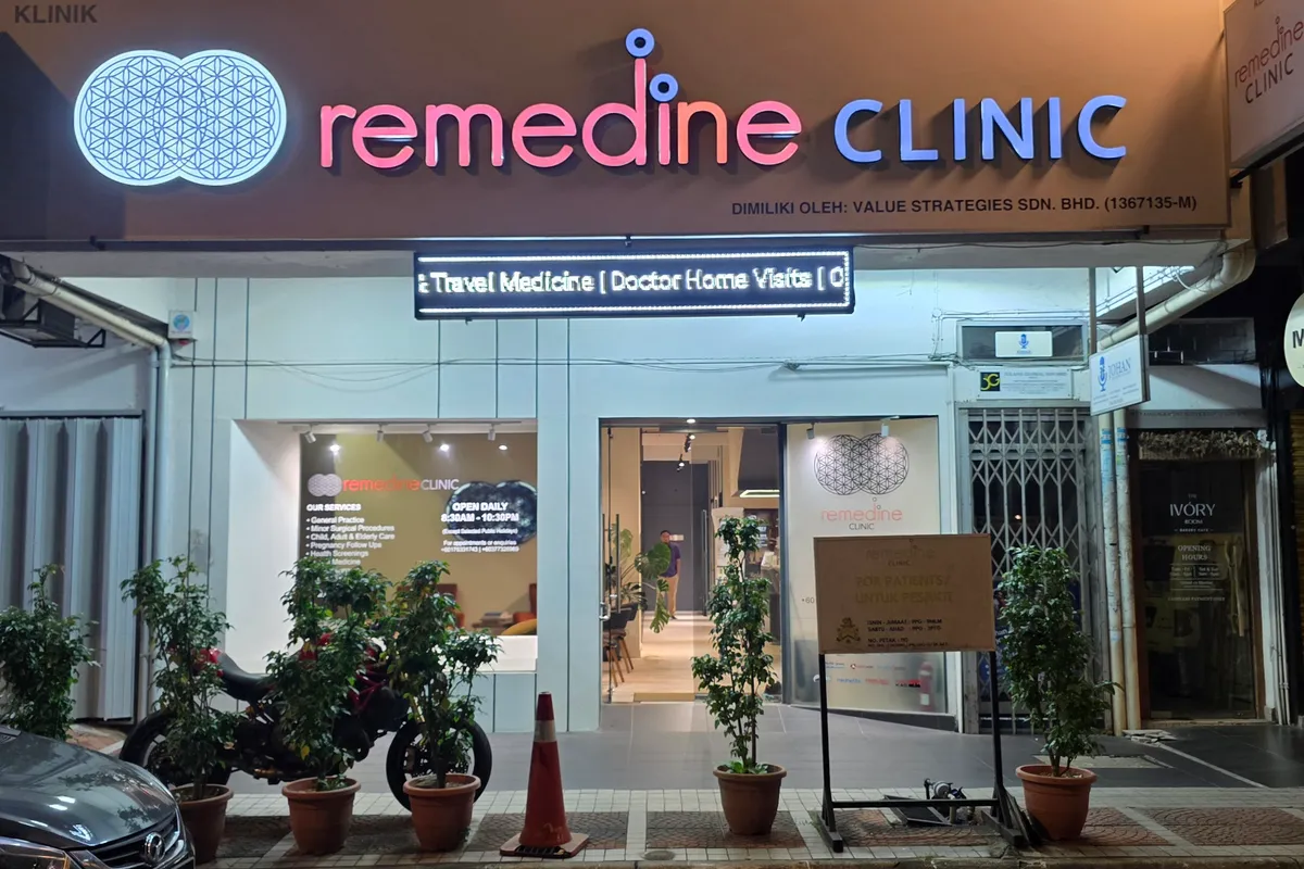 Remedine Clinic TTDI storefront lit at night on Persiaran Zaaba