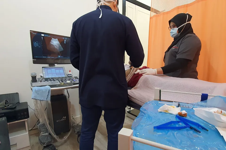 A scan in progress in the ultrasound room at Remedine Clinic