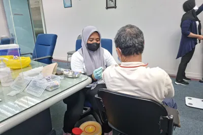 A vaccination being administered before departure
